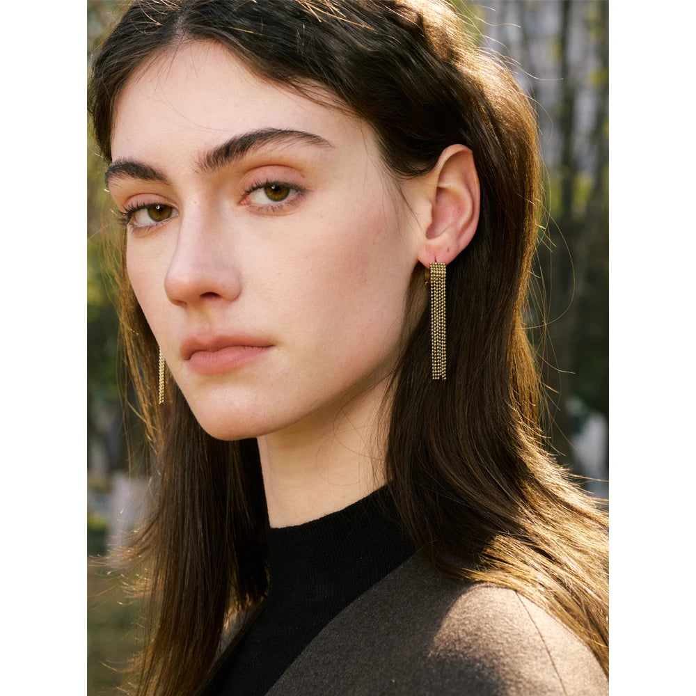 Solène Gold Tassel Huggie Earrings